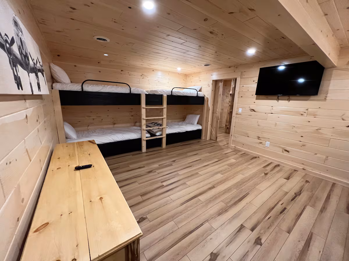 Basement bunkroom in the cabin with two twin-over-twin bunk beds, for the largest groups booking both stays
