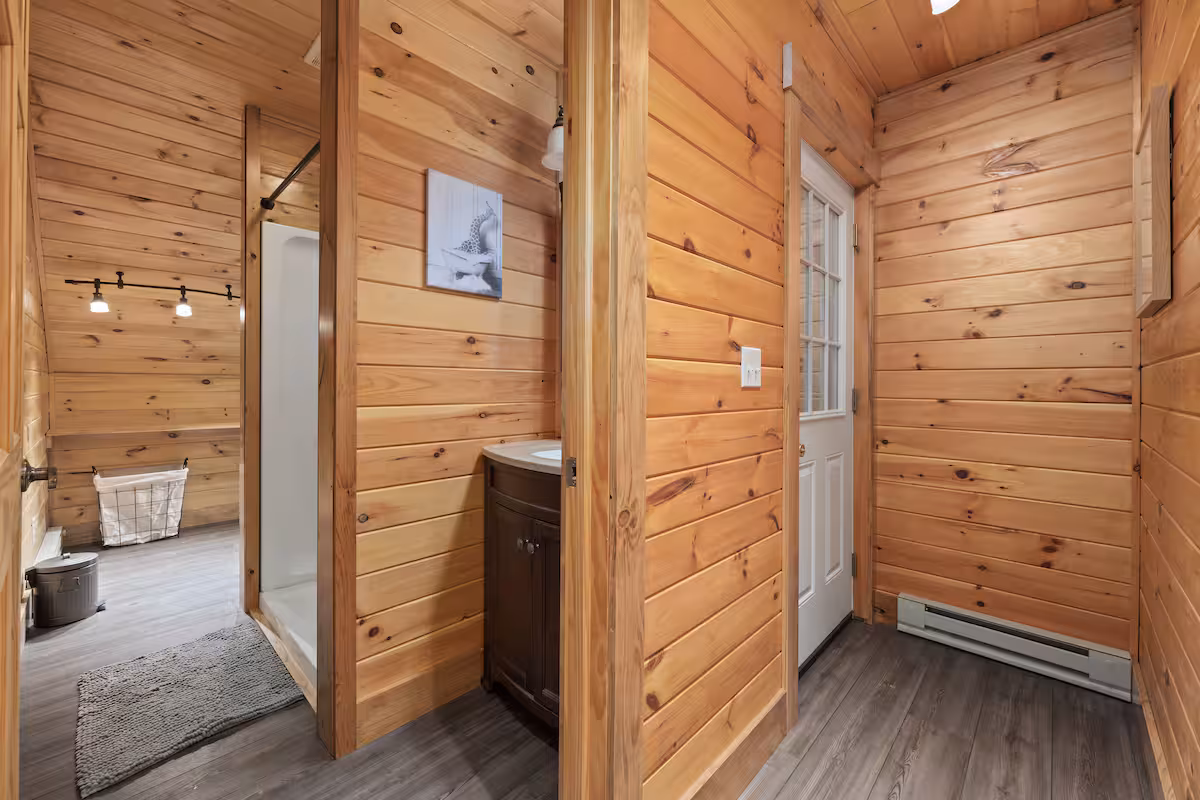 Bathroom and private stairway entry door finished in pine